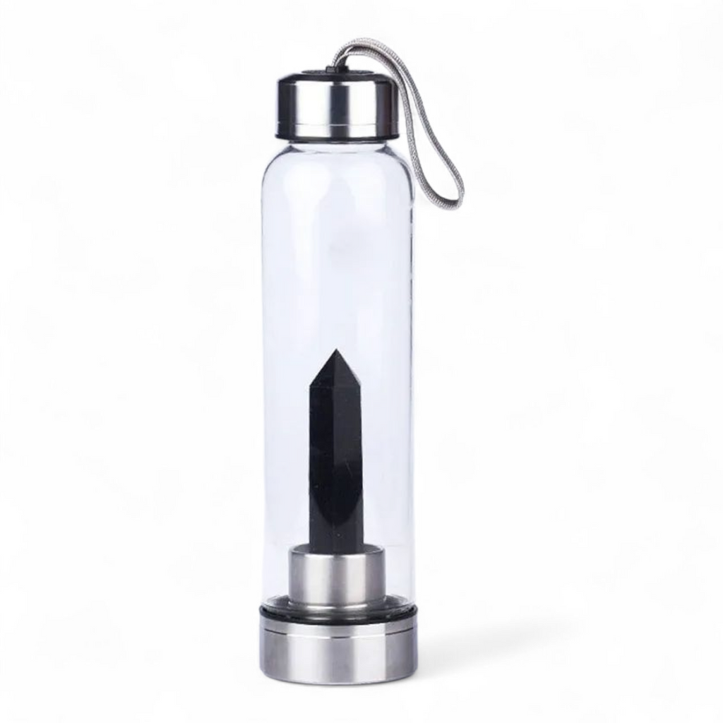 Botella de vidrio con cuarzo obsidiana